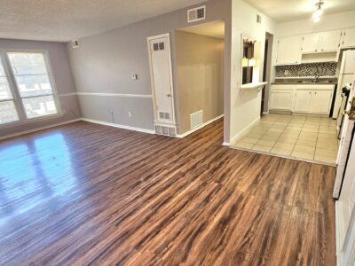 empty living room with kitchen